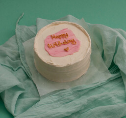 colored cakes with cream and various inscriptions