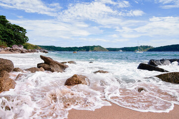 Beautiful landscape with sea waves and stones.