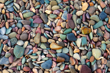 Colorful stones on the shore of Waterton Lake in Waterton Lakes National Park