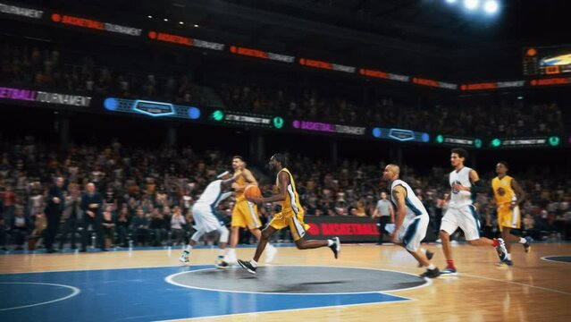 Cinematic Slow Motion Footage of Two International Teams Playing Basketball at a Crowded Arena. Yellow Team Player Dribbling with the Ball, Scoring a Beautiful Goal During an Intense Match