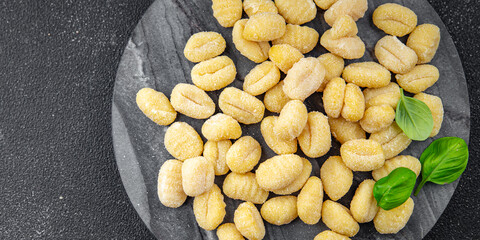 gnocchi raw potato food delicious second course Cooking appetizer meal food snack on the table copy space food background rustic top view keto or paleo diet vegetarian vegan food no met