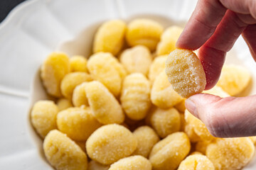 gnocchi raw potato food delicious second course Cooking appetizer meal food snack on the table copy space food background rustic top view keto or paleo diet vegetarian vegan food no met