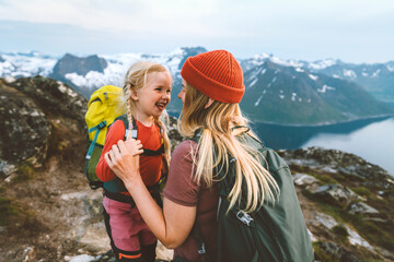 Mother hiking with daughter in Norway mountains travel together family time healthy lifestyle...