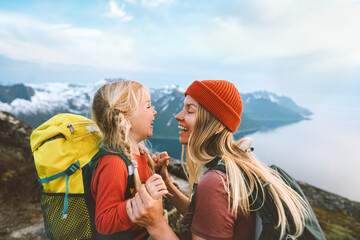 Mother playing with daughter child outdoor hiking in Norway together happy family lifestyle...