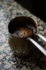 Turkish coffee in Turk. Coffee pot. Delicious drink, recipe. Cezve. High quality photo