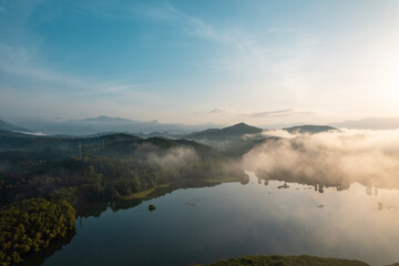 Fototapeta premium Foggy morning lake landscape photo, Misty morning aerial drone shot from Kannur Kerala