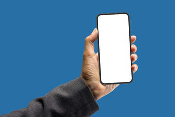 Businessman holding smartphone, white blank screen isolated on blue background