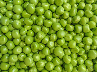Fresh green peas close-up as a background