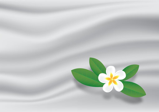 Tropical flower on wrinkles white fabric