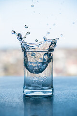 Splash of water in a transparent glass