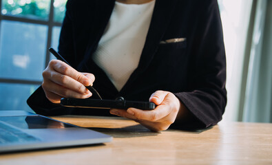 close up hands multitasking man using tablet, laptop and cellphone connecting wifi