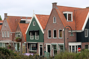 Typical houses in the old town of Volendam, Netherlands - obrazy, fototapety, plakaty
