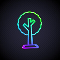 Glowing neon line Tree icon isolated on black background. Forest symbol. Vector