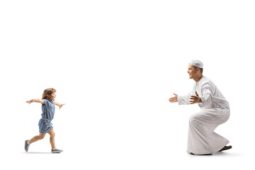 Little girl running to hug a man in traditional muslim clothes
