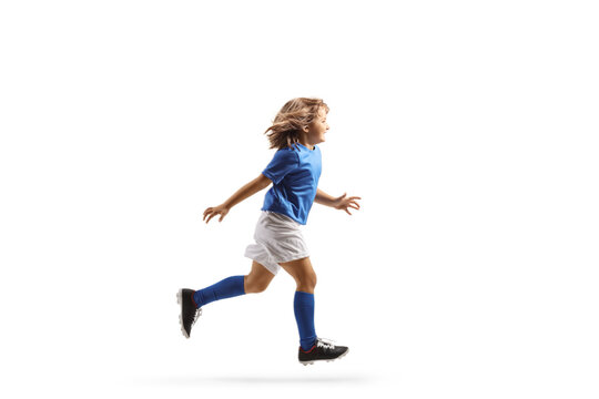 Full length profile shot of a girl in a football kit running