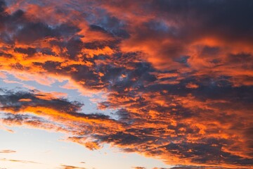 Dramatic red and orange sky above Monkey Mia, Western Australia. Red and orange colored clouds during sunset. Impressive colors during sunset. The sky looks like it is on fire during the late hours. 