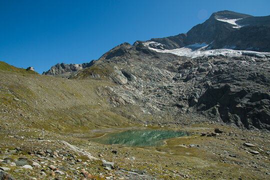View of Giogo Lungo refuge near the glacier in the Italian alps