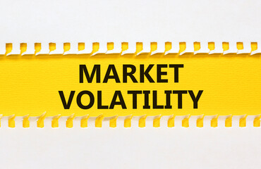 Market volatility symbol. Concept words Market volatility on beautiful yellow paper. Beautiful...