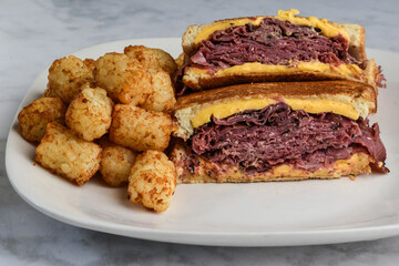 pastrami melt sandwich  with tater tots