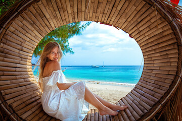 Summer holiday vibes with a tropical beach and blue ocean. Travel influencer enjoying the paradise....
