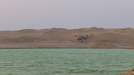 Landscape view of salt lake and desert dunes in Abudhabi