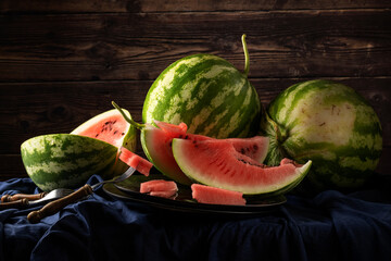 Fresh raw watermelons on the table, healthy eating themes
