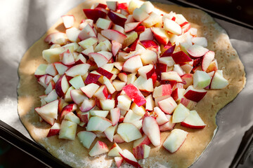 Chopped apples. Apple pieces. Red cut apple for pie. Selective focus