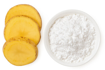 Potato starch in a white ceramic bowl next to slices of raw potato with skin isolated on white from above.