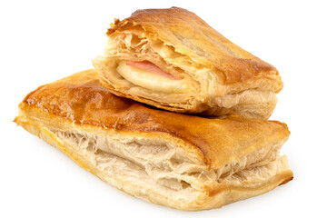 Savory filled puff pastry on top of whole puff pastry isolated on white.
