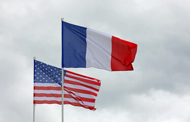 flags of France and USA waving together symbol of Cooperation