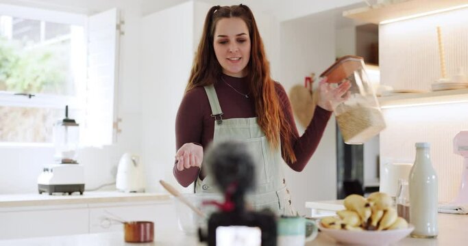 Live streaming, woman and baking for a video in the kitchen for a cooking tutorial on the internet. House, baker or a female influencer or chef speaking about food for a broadcast or online blog