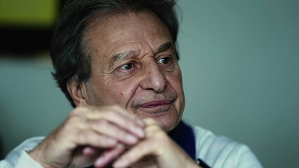 Elderly man attentively nodding in consensus, close-up showcasing understanding during off-camera...