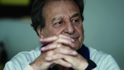 Elderly man attentively nodding in consensus, close-up showcasing understanding during off-camera...