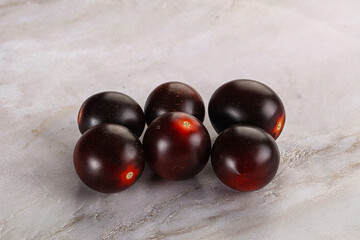 Raw ripe black kumato tomato