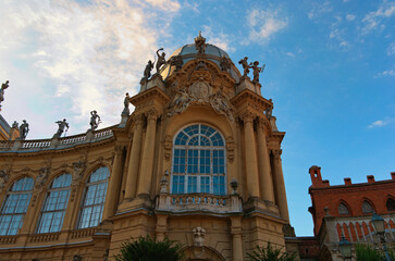 Fototapeta na wymiar Scenic view of ancient building in the Vajdahunyad Castle (Hungarian agriculture museum). Beautiful decorated facade with many statues. Architecture and landmark concept. Budapest, Hungary