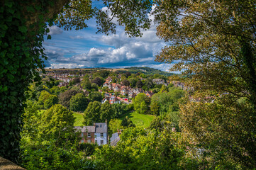 A tree framed view west from the upper levels of the castle keep in Lewes, Sussex, UK in summertime