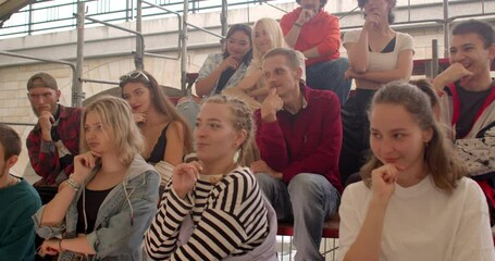 Young people repeat after coach. Social Gathering event or gathering group of individuals comes together for socializing, entertainment, building connections. Students networking events, lifestyle.