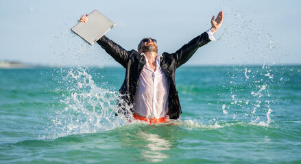 Business man in wet suit in sea water. Crazy business vacation. successful happy businessman finally relaxing. businessman has success. successful business deal. Businessman excited in sea water