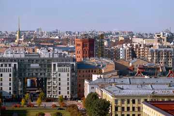 Obraz premium Beautiful European city in autumn time. The center of the old big city with residential buildings taken on a sunny autumn day.