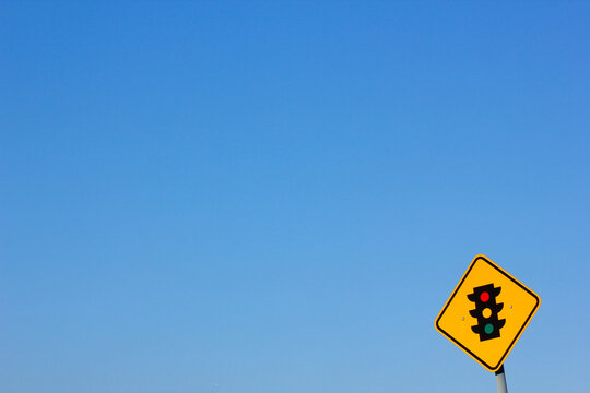 Traffic light sign with blue sky in the background