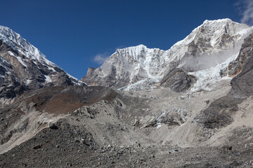 Obraz premium Tashi Lapcha and Pharchamo Peak region in the Himalayas, Nepal. Snow-capped mountains and glaciers under a blue sky.