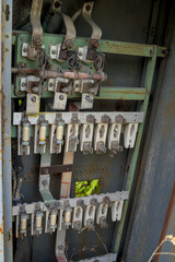 Fototapeta na wymiar Electrical panel with fuses in an abandoned factory