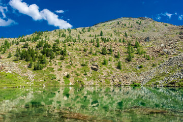 Reflection in one of the Avic Lakes in Champorcher, Aosta Valley,  Italy