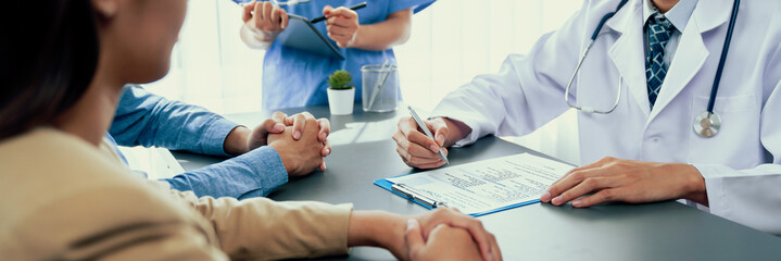 Doctor show medical diagnosis report and providing compassionate healthcare consultation to young...