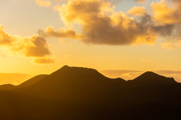 Beautiful silhouette of Lanzarote volcanos at sunset, Canary Islands,  Spain