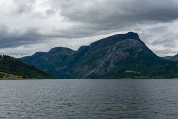 Majestic lenticular cloud over a fjord, in Norway