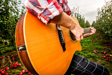 Man's hands playing acoustic guitar, close up. Acoustic guitars playing. Music concept. Guitars...