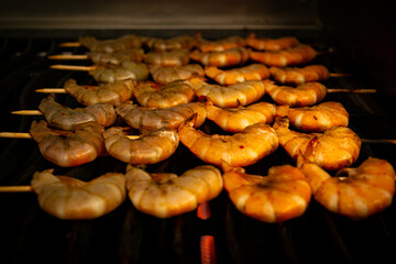 shrimp kebab. Grilled shrimp on wooden skewers