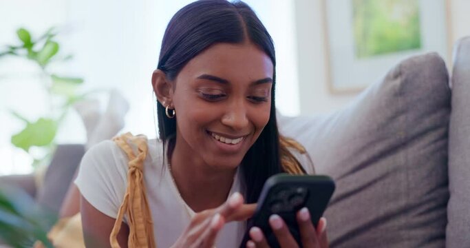 Woman, couch and relax with phone for funny communication, social media scroll and networking at home. Young african person on mobile with chat, internet search and meme or subscription on her sofa