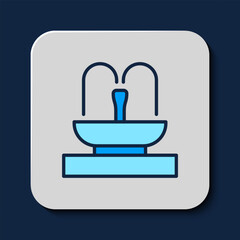 Filled outline Fountain icon isolated on blue background. Vector